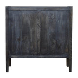 Meuble TV bois couleur bleu nuit pour chambre à coucher pour une décoration intérieur chaleureuse et exotique.