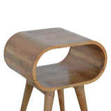 Table de chevet en bois rustique de forme ovale.